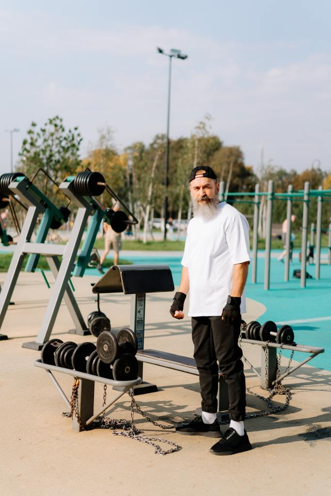 older man lifting weights